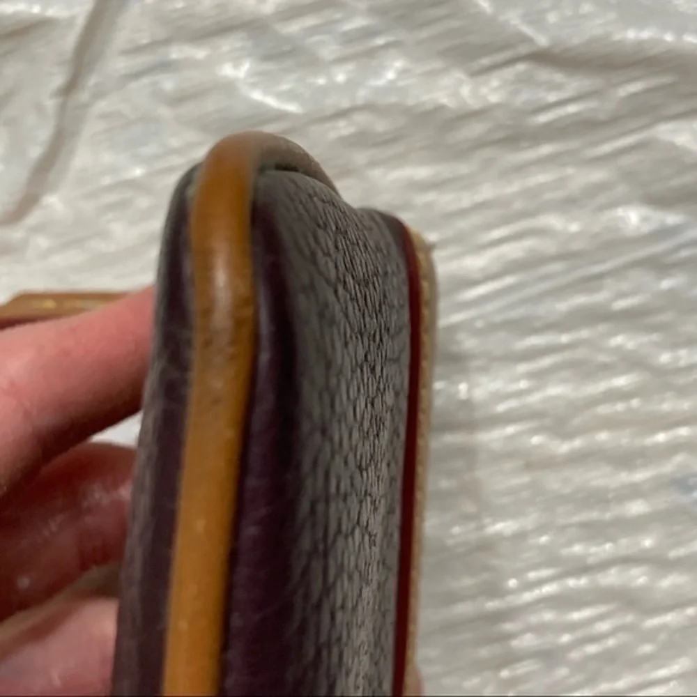 Dooney & Bourke purple and brown leather cosmetic bag